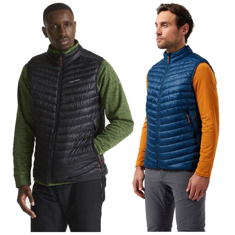 Two men are wearing insulated vests one in black and green layered clothing and the other in blue with an orange shirt each standing against a plain background.