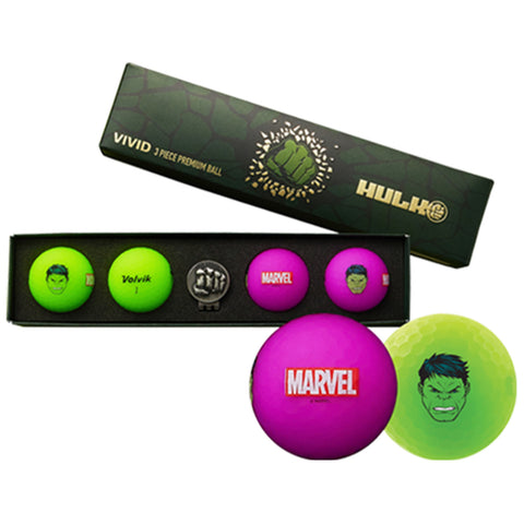 A box contains vibrant golf balls featuring Hulk designs and logos with one green ball displaying an angry Hulk face and another pink ball marked Marvel surrounded by two additional balls and a black fist emblem.