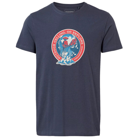 A navy blue t-shirt displays an illustrated circular design featuring a waterfall and mountains with the text OUTDOOR CALLING GO EXPLORE and the brand name CRAGHOPPERS at the top and bottom.