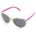 Colorful sunglasses with a cat-eye shape resting on a reflective surface displaying a combination of light colors and geometric patterns on the frame with gray tinted lenses.