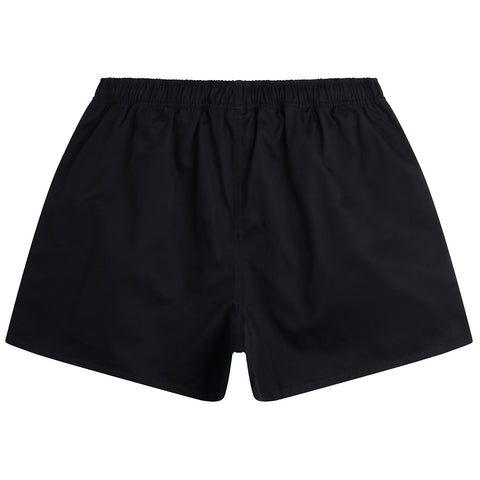 Black swim trunks feature an elastic waistband and a loose fit designed for comfort and mobility suitable for swimming or beach activities. The background is plain and unobtrusive.