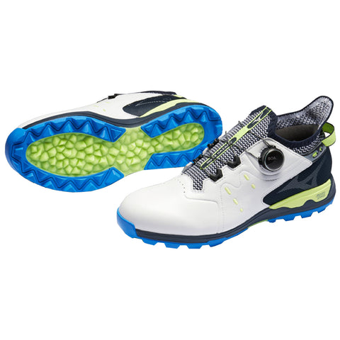 A pair of athletic shoes designed for performance is displayed with an innovative lacing system featuring a dial for adjustment showcasing a white upper with blue and green accents and a textured sole.