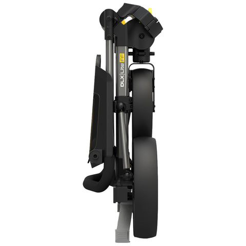 A compact black stroller is folded neatly upright demonstrating its lightweight design with two large rear wheels and a handlebar at the top suitable for easy transportation.