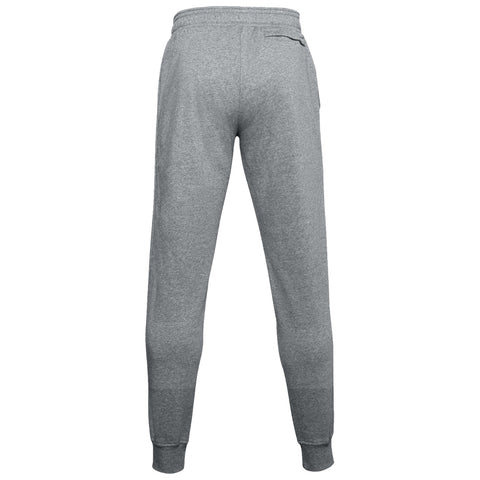 Black sweatpants with an elastic waistband are worn by a person standing in athletic shoes in a neutral setting. The pants feature a small logo on the left thigh.