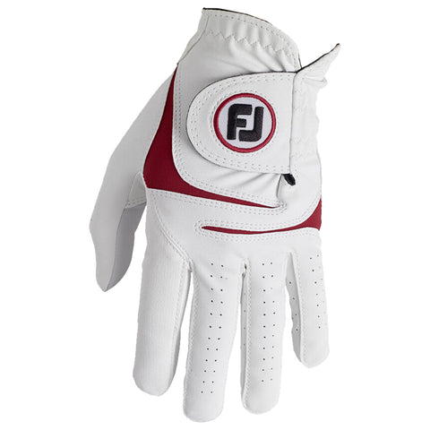 A white golf glove with red accents rests flat showing its palm side designed for grip with perforations for breathability used while playing golf in outdoor settings.