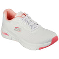 A white athletic shoe is positioned at an angle displaying its textured upper and pink accents the shoe features laces for fastening and is designed for comfort and support.