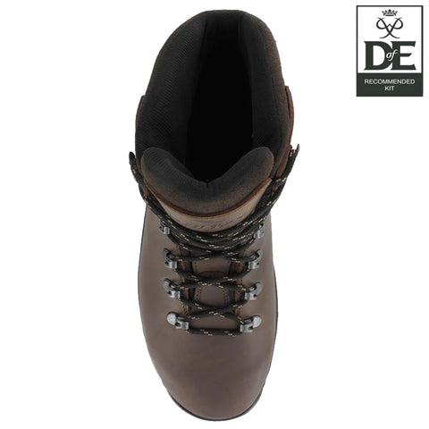 A brown hiking boot is positioned upright showcasing the laces and eyelets while the interior reveals a padded opening this footwear is featured alongside a badge indicating recommended kit