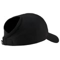 A black cap with an extended visor sits on a flat surface showcasing its smooth fabric and minimalist design intended for wearing outdoors while providing sun protection.