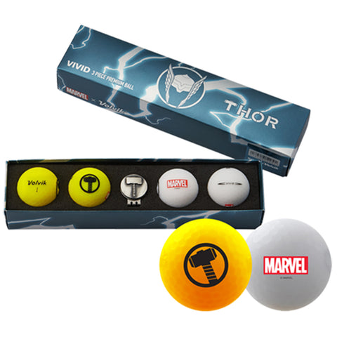 A box labeled Thor contains five golf balls with logos including Marvel and Volvik. The balls are designed for premium play with vibrant colors yellow and white visible prominently.