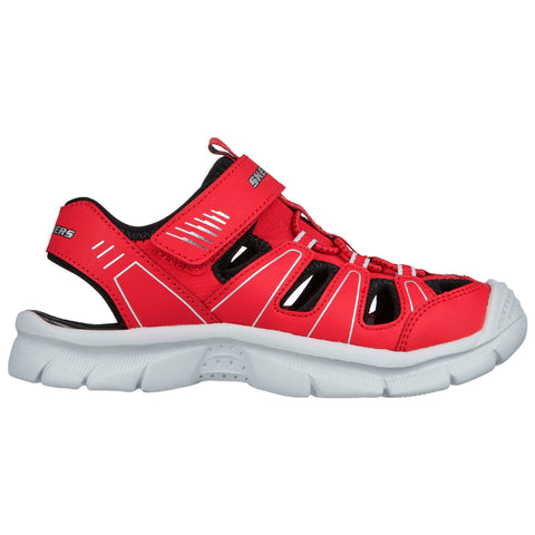 A red athletic sandal features adjustable straps and cut-out openings for ventilation the sandal is positioned on a neutral background suggesting a focus on the shoe's design and color.