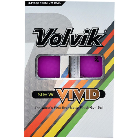 A packaging contains two vibrant purple golf balls labeled Volvik new VIVID highlighting their matte finish positioned against a colorful striped background with product details prominently displayed.