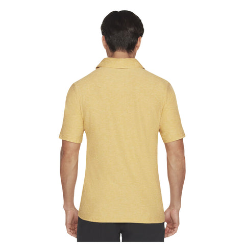 A person wears a yellow short-sleeved polo shirt facing away. The background is plain, emphasizing the shirt's color and design without distractions from the surrounding environment.