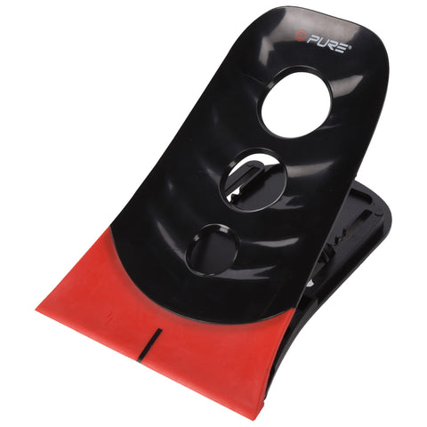 A black and red putting trainer upright showing its curved surface and two circular cutouts designed for grip. The background is plain and features no additional elements.