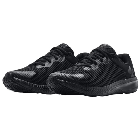 Black athletic shoes are positioned side by side showcasing a sleek design with a breathable mesh upper and textured outsole suggesting fitness activities in an indoor or retail setting