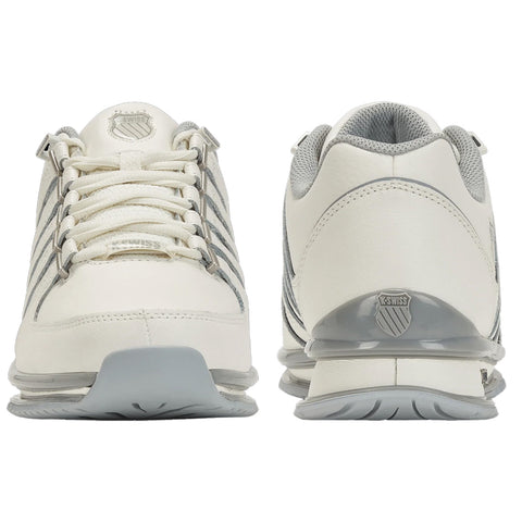 White athletic shoes with grey accents are displayed side by side showcasing their laced front and cushioned soles in a neutral background highlighting the design and features.