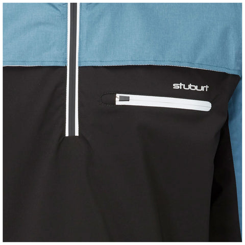 A windbreaker features a blue upper section and a black lower section with a zippered pocket. The brand "stuburt" is displayed on the black area, emphasizing a sporty style.