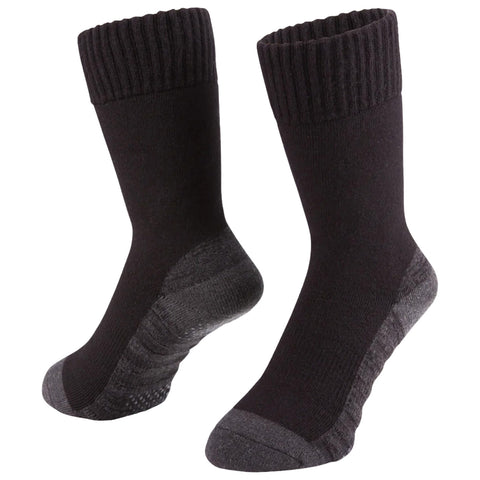 A pair of black socks stands upright with a ribbed top and reinforced heels. The socks are displayed against a plain background, emphasizing their texture and design features.