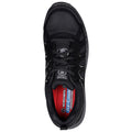 A black athletic shoe is displayed from a top-down view showcasing its laces and cushioned insole. It features a textured surface and is designed for comfort and support in active contexts.