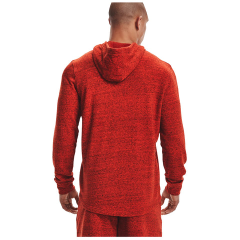 A person stands with their back to the viewer wearing a red hooded sweatshirt and matching pants in a neutral background likely indoors or in a studio setting.