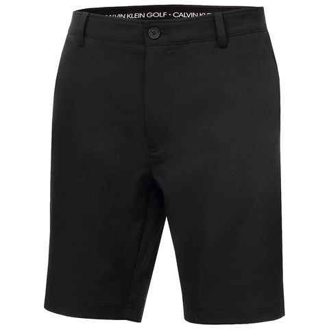 Black shorts are displayed front-facing featuring a button and belt loops with a label visible at the waistline indicating Calvin Klein Golf suggesting a sporty context suitable for golfing or casual wear.