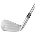 A silver golf club is positioned with its angled face visible highlighting the grooves on the hitting surface designed for accuracy in striking a golf ball in an open setting.