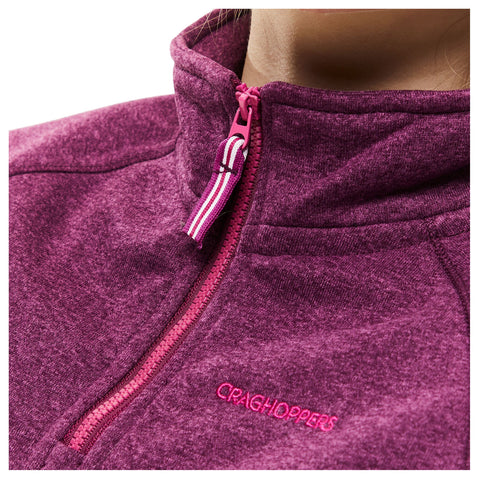 A close-up of a purple fleece jacket featuring a pink zipper and a logo on the chest area highlighting a casual outdoor apparel design often suitable for layering in cool weather.