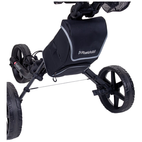 A black golf push cart with a storage bag is positioned upright in a display. The cart has large rubber wheels and features a sleek design for easy maneuverability.