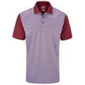 A short-sleeved polo shirt features a maroon solid color on the sleeves and collar with a patterned fabric in shades of blue and white on the body, presented against a plain background.