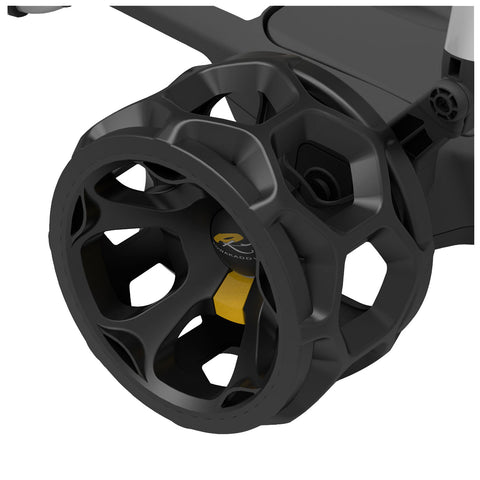 A black wheel with a hexagonal design is attached to a device primarily for motion its context suggests usage in a mechanical or sports setting emphasizing performance and stability.