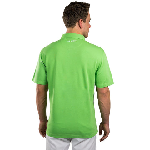 A person is standing with their back turned wearing a bright green polo shirt displaying the text LIVE LUCKY at the collar in an uncluttered white background.