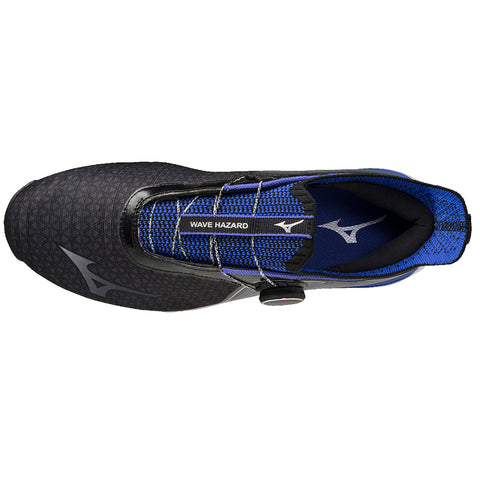 Black and blue athletic shoe with a textured upper and a centrally located tightening mechanism is positioned against a plain background showcasing its design and branding details