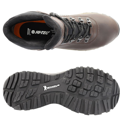 A brown hiking boot is presented with a focus on the top view showing laces and a padded collar alongside a textured black sole marked with the Michelin logo, suitable for outdoor activities.