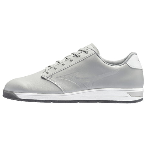 A light gray athletic shoe is positioned sideways showcasing its sleek design with a textured upper and white accents providing a sporty look suitable for casual or active use.