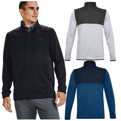 A man in a black pullover stands confidently while two additional pullovers in gray and blue are displayed beside him in a promotional context showcasing apparel options.