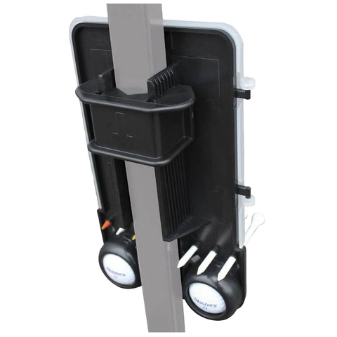 A black and gray holder is attached to a vertical post storing golf tees and markers while providing a convenient spot for organizing accessories in a golfing or outdoor context.