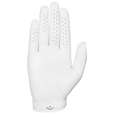 A white golf glove rests with fingers extended showing a smooth surface and small ventilation holes along the fingers designed for grip and comfort during golfing activities.