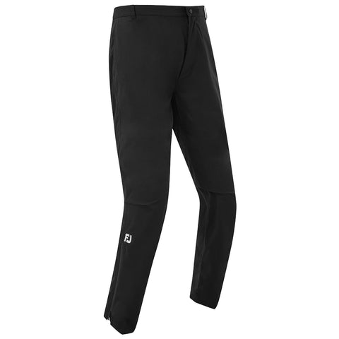 Black trousers are displayed upright showing a sleek design with a button closure and side pockets highlighting a sporty style suitable for casual or athletic contexts. FJ logo is visible on the lower leg.