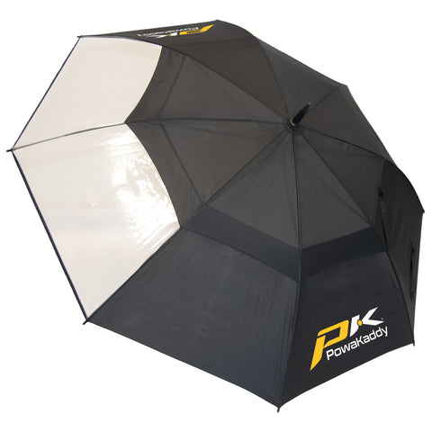 A golf umbrella with a black canopy and a white panel is opened wide showcasing its structure and branding with the logo of Powakaddy visible on one side.