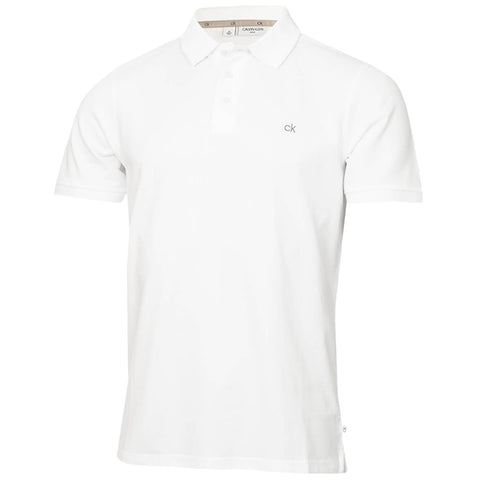 A white polo shirt hangs unobtrusively showcasing its short sleeves and collar with a small logo stitched on the chest its fabric appears smooth and lightweight inviting casual wear