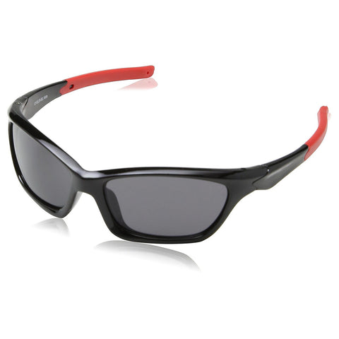 Black sunglasses with a glossy finish and red accents sit on a flat surface reflecting light while the lenses block visibility through them indicating their purpose for sun protection.