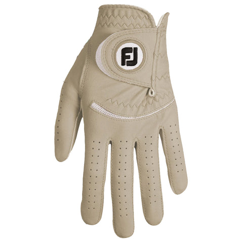 A beige golf glove is displayed open with an adjustable strap and perforations for breathability resting on a flat surface indicating readiness for use in a sport setting.