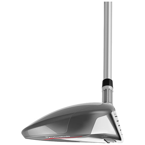 A golf club head is positioned upright with a sleek metallic finish reflecting light the club is designed for maximizing distance and accuracy on a golf course.