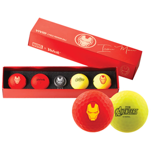 A red box contains five colorful golf balls featuring Iron Man designs and the Avengers logo while being displayed on a black foam insert inviting a collector or fan.