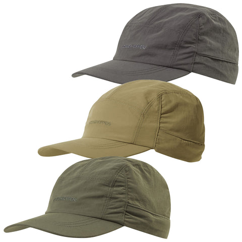 Three caps are stacked vertically in varying shades of green and tan displaying a brand logo on the front each cap features a curved brim designed for outdoor activities