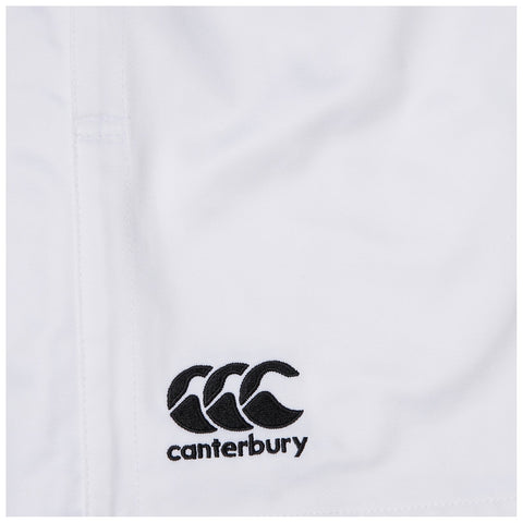 A white fabric featuring a black embroidered logo consisting of three stylized overlapping shapes and the word "canterbury" below in bold text, indicating a sportswear brand.