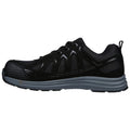 A black athletic shoe is positioned sideways showcasing its sleek design and textured surface the shoe features lace up closure and a rubber sole suitable for sports or casual wear