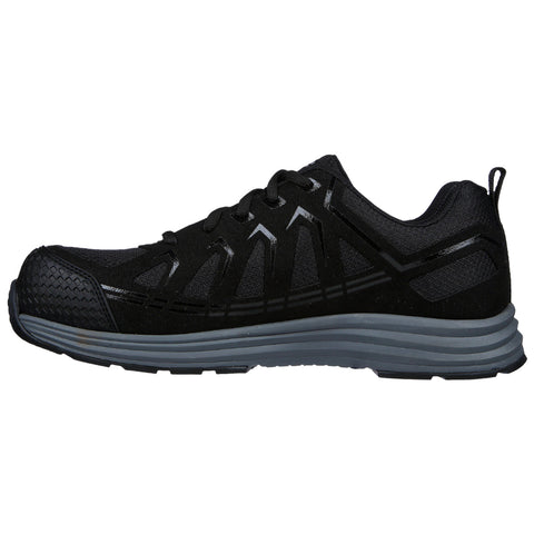 A black athletic shoe is positioned sideways showcasing its sleek design and textured surface the shoe features lace up closure and a rubber sole suitable for sports or casual wear