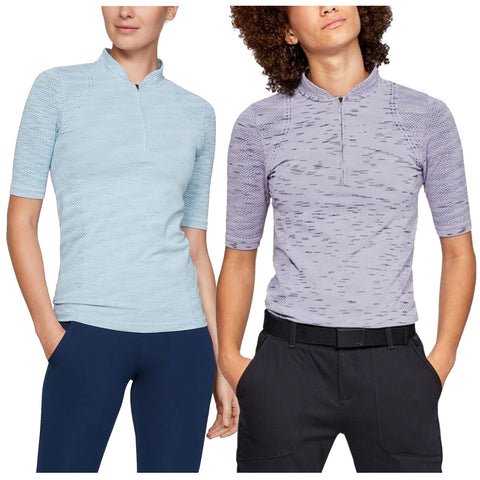 Under Armour Ladies Seamless Half Zip Polo Shirt Two individuals wearing short-sleeve, zip-neck athletic shirts stand facing slightly different directions. One shirt is light blue and the other is light purple. The setting appears casual, highlighting activewear.