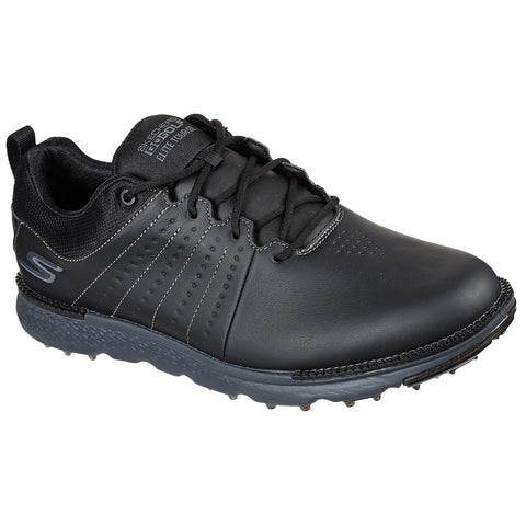 A black golf shoe with a sleek design features a textured leather upper and a rubber sole with spikes for traction on the course made by Skechers labeled Elite Tour.