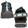 A pair of sporty shoes is displayed with black mesh fabric and aqua accents The shoes feature adjustable straps and a textured rubber sole designed for outdoor activities